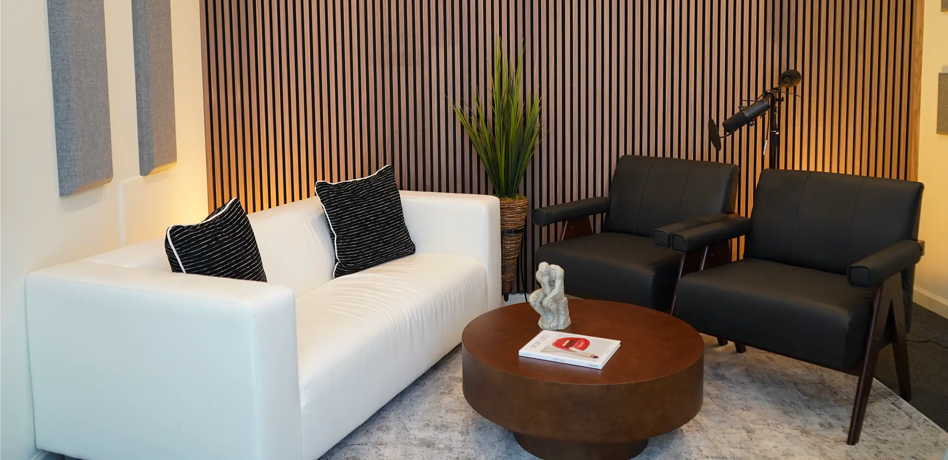 Podcast studio set with microphones and seating